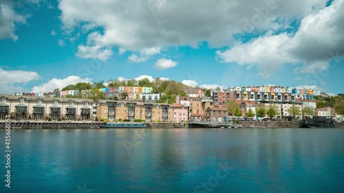 Time lapse of clouds over multi-coloured houses and harbourside in Bristol, UK photo