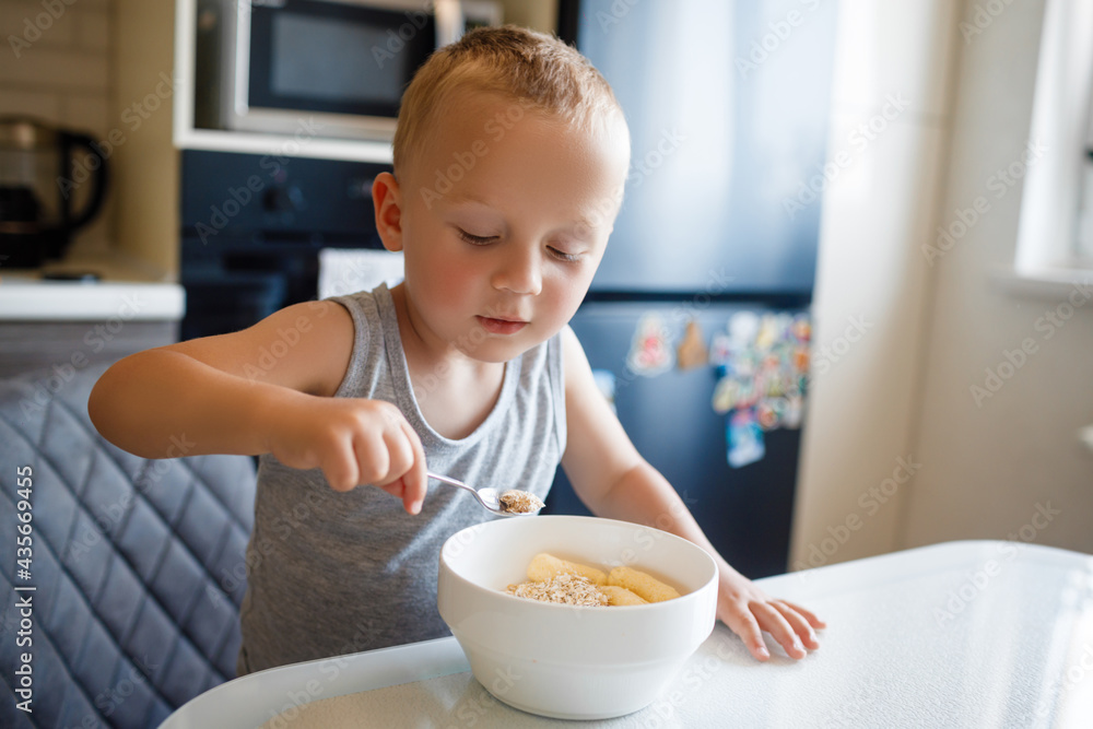 Morning breakfast with the baby. Mother feeds the child with breakfast. Morning breakfast with the baby. Mother feeds the child with breakfast.