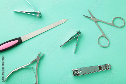 Wallpaper Mural Tools of a manicure set on mint background Torontodigital.ca