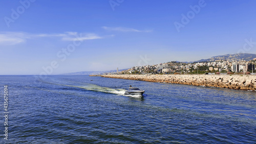 Boat in the bay. Holiday vacation with family and friends. Speed boat cruising © G.E.G Digital Media