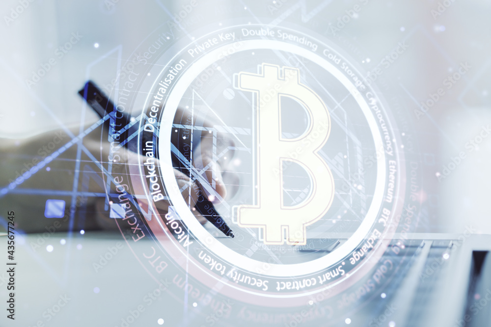 Naklejka premium Creative Bitcoin concept with hand writing in notebook on background with laptop. Multiexposure