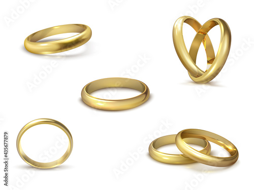 Realistic gold wedding rings isolated on white background symbol of love and marriage