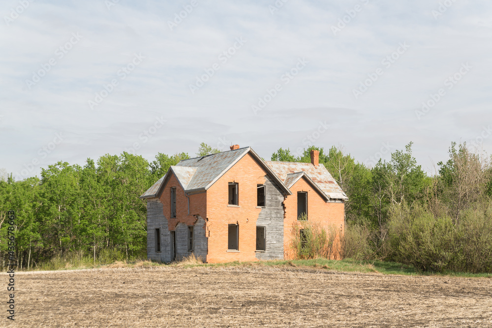 abandoned two story house with orange siding abandoned two story house with orange siding