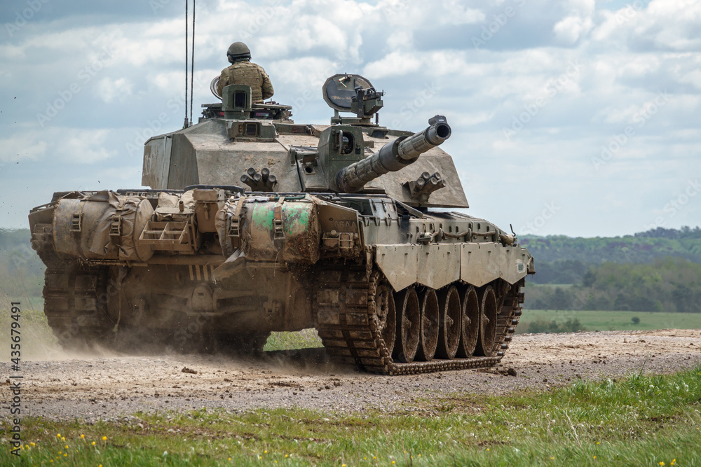 Obraz premium British army Challenger 2 ii FV4034 Main Battle Tank on deployment in action on a military battle exercise, Wiltshire UK