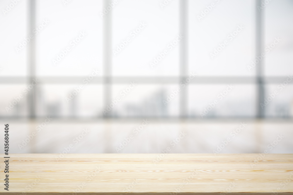 Blank wooden desk with light empty office room with big window on background, mock up Blank wooden desk with light empty office room with big window on background, mock up