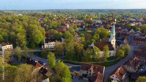 Aerial View of Kuldiga Old Town With Red Roof Tilesand Evangelical Lutheran Church of Saint Catherine in Kuldiga, Latvia. © Uldis
