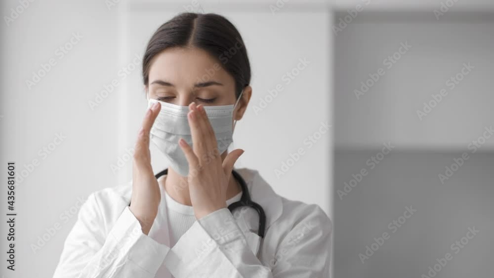 Doctor woman medical mask face close up clinic office consultation Doctor woman medical mask face close up clinic office consultation
