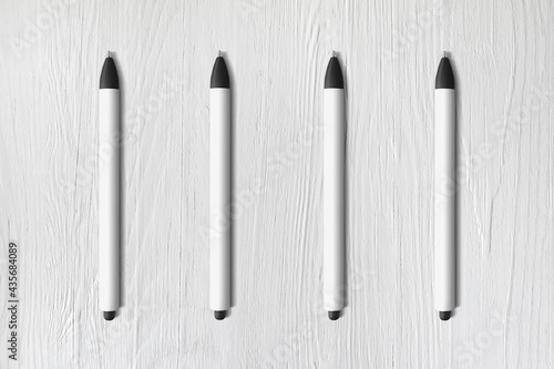 Mock up for pen white and back universal. Elements for design on white wooden background