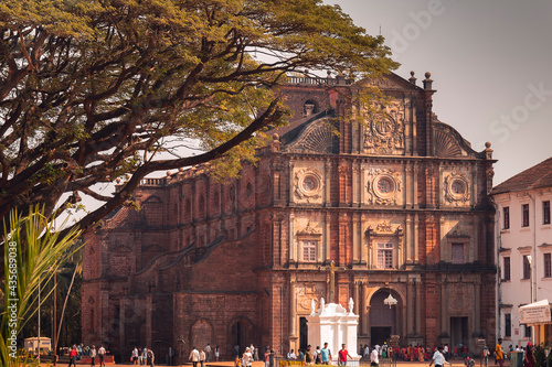 A day view on The Basilica of Bom Jesus and tree in front in Goa