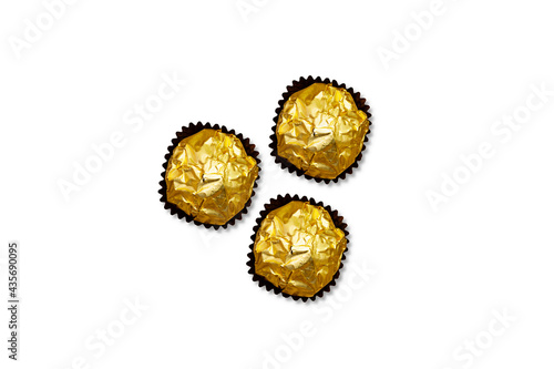 golden premium chocolate sweets isolated on white background