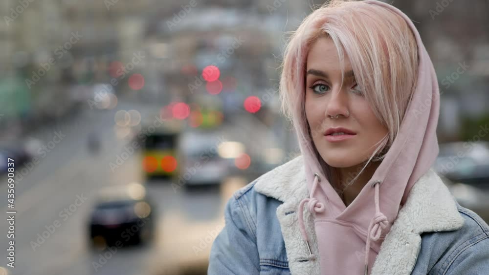 Girl With Pink Hair. Portrait Of Young Girl With Pierced Nose. Wind Blows Her Hair. Girl With Pink Hair. Portrait Of Young Girl With Pierced Nose. Wind Blows Her Hair.