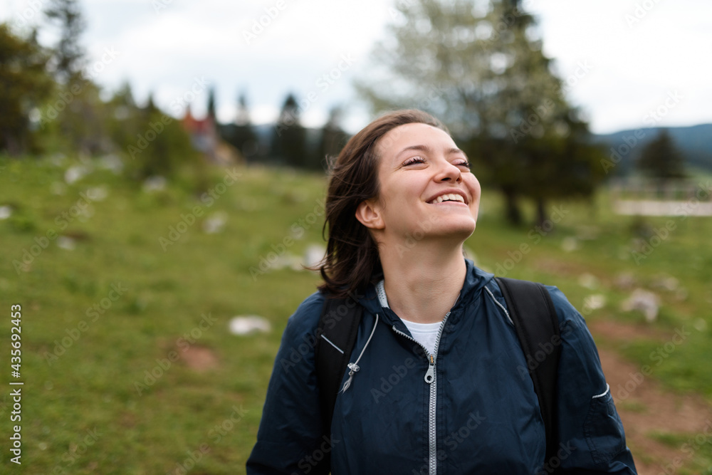 portrait of a woman hiking with a backpack on her back. High quality photo portrait of a woman hiking with a backpack on her back. High quality photo