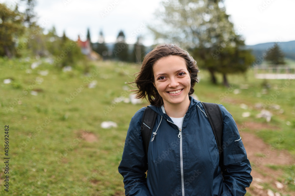 portrait of a woman hiking with a backpack on her back. High quality photo