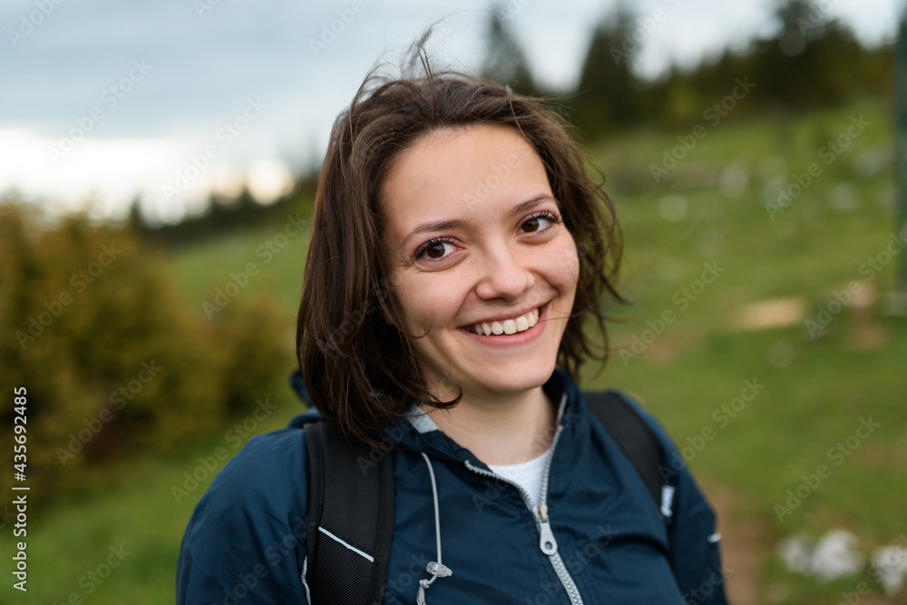 portrait of a woman hiking with a backpack on her back. High quality photo portrait of a woman hiking with a backpack on her back. High quality photo