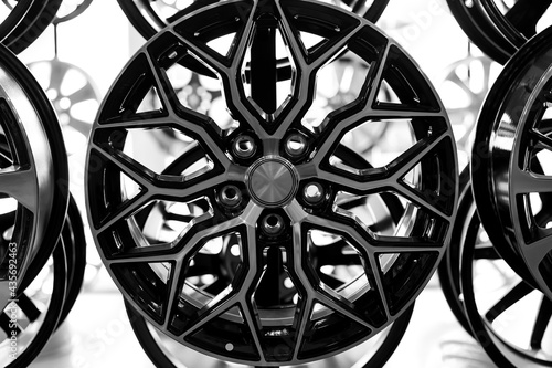Black alloy wheels for premium cars, close-up. Purchase and replacement of autodisks