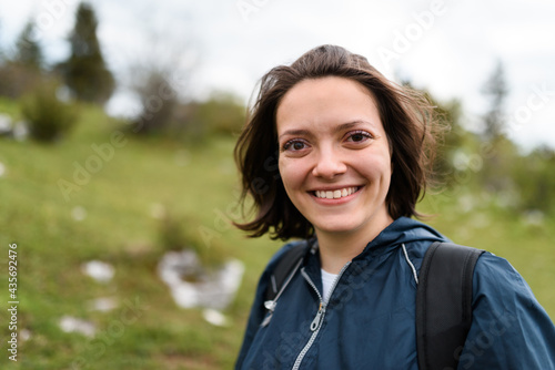 portrait of a woman hiking with a backpack on her back. High quality photo
