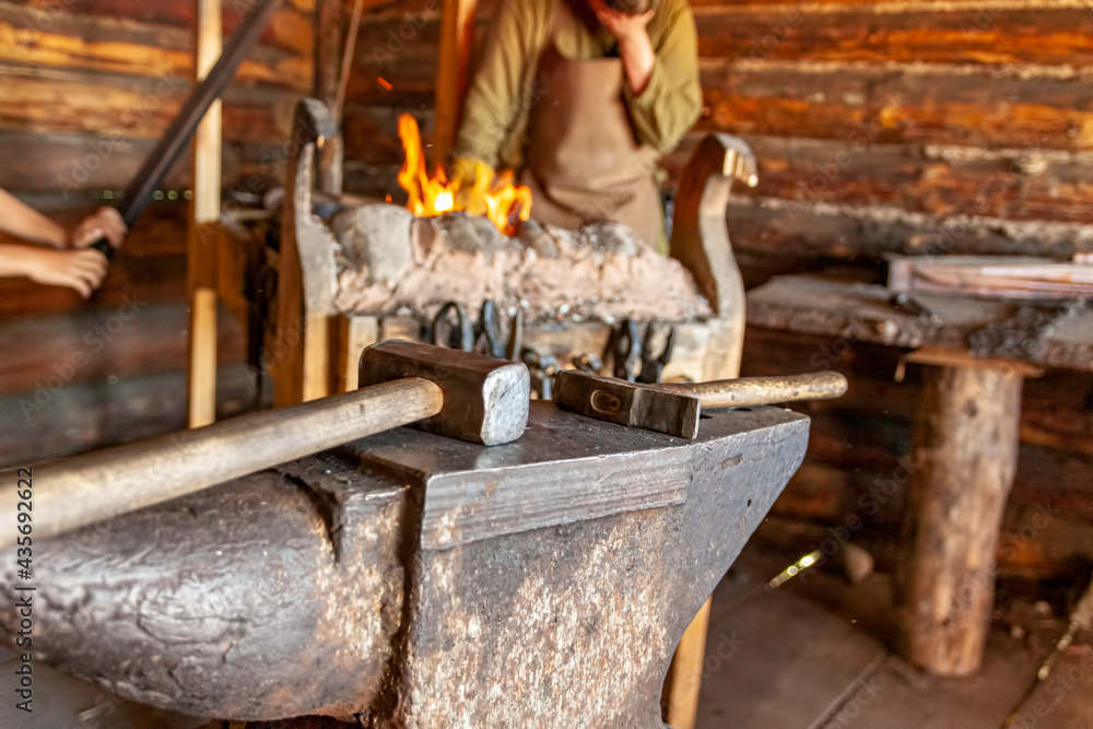 Tool in the forge against the background of the fire. Tool in the forge against the background of the fire.