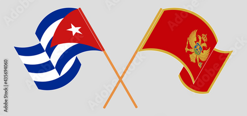 Crossed and waving flags of Cuba and Montenegro