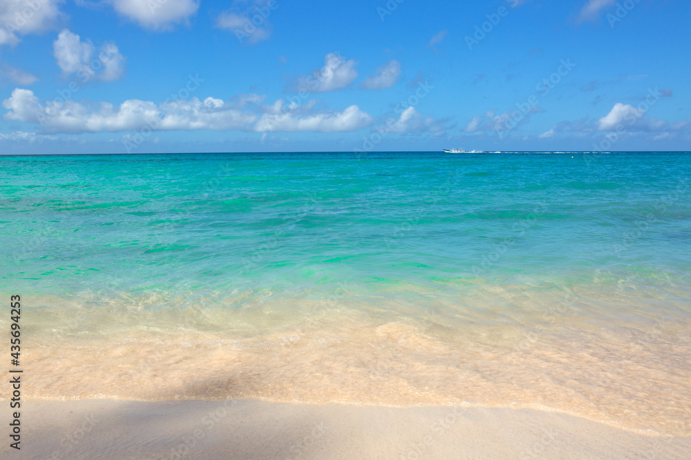 Beautiful caribbean sea and blue clouds sky.