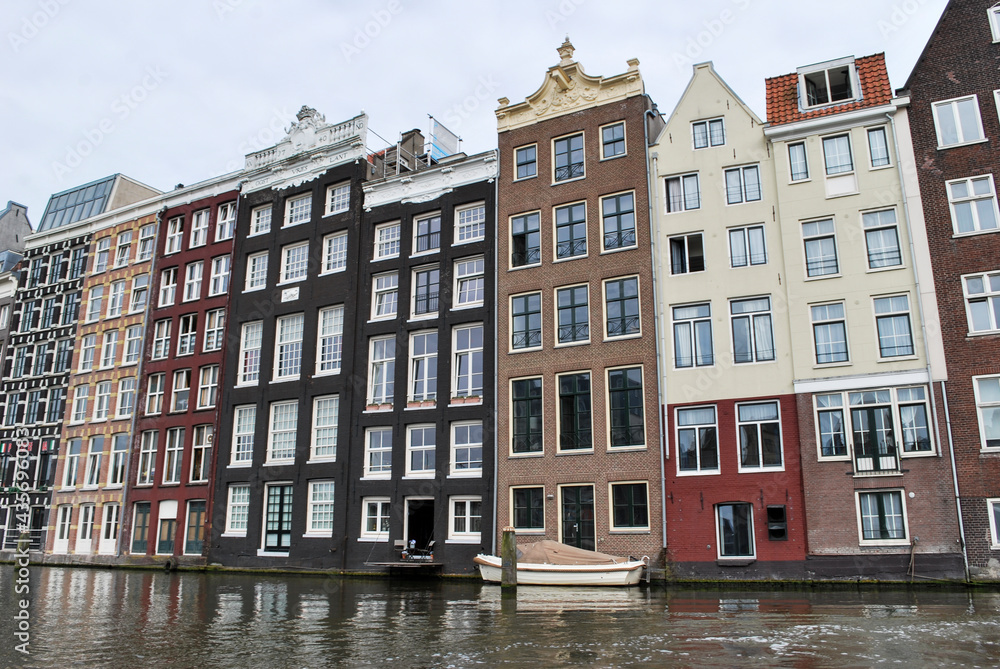 Traditional Dutch medieval buildings in Amsterdam, Netherlands. view from the canal.