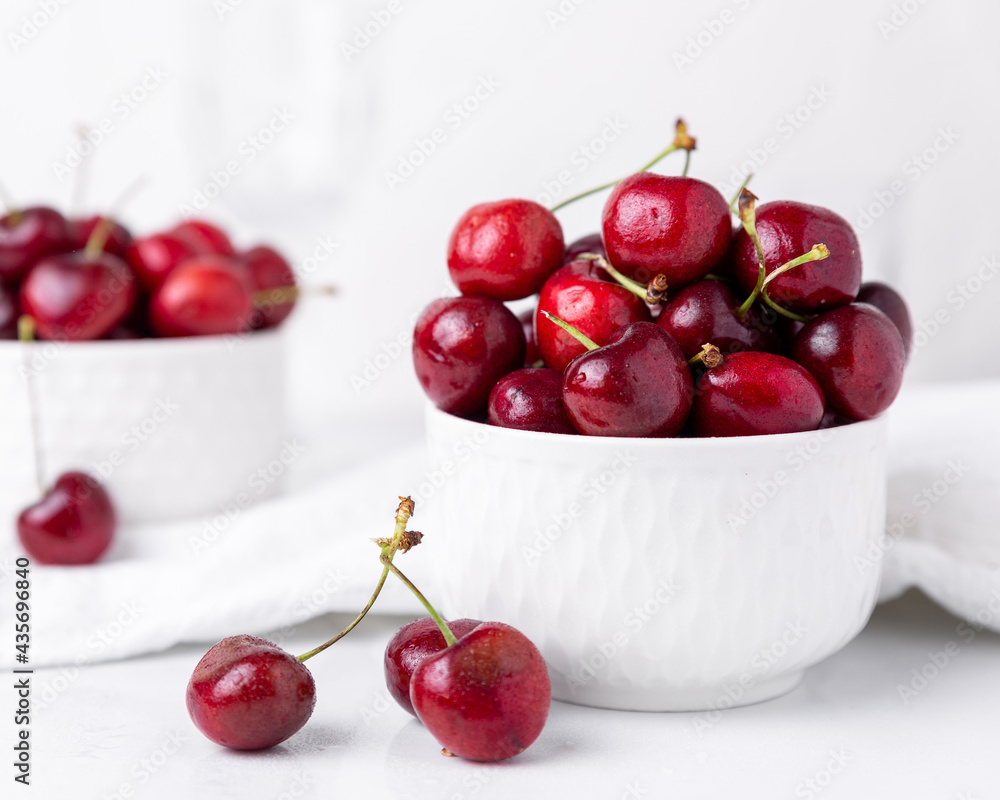 Two small bowls of beautiful fresh ripe cherries