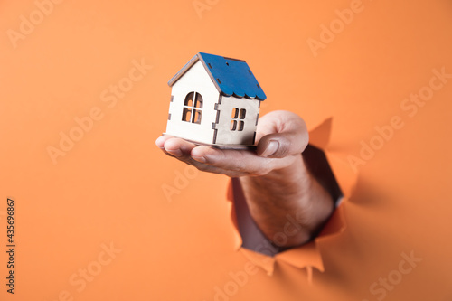 hand holding a house