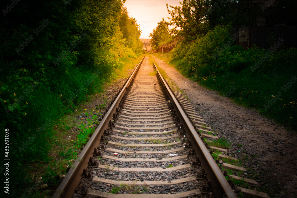 the railway going into the distance at sunset the railway going into the distance at sunset