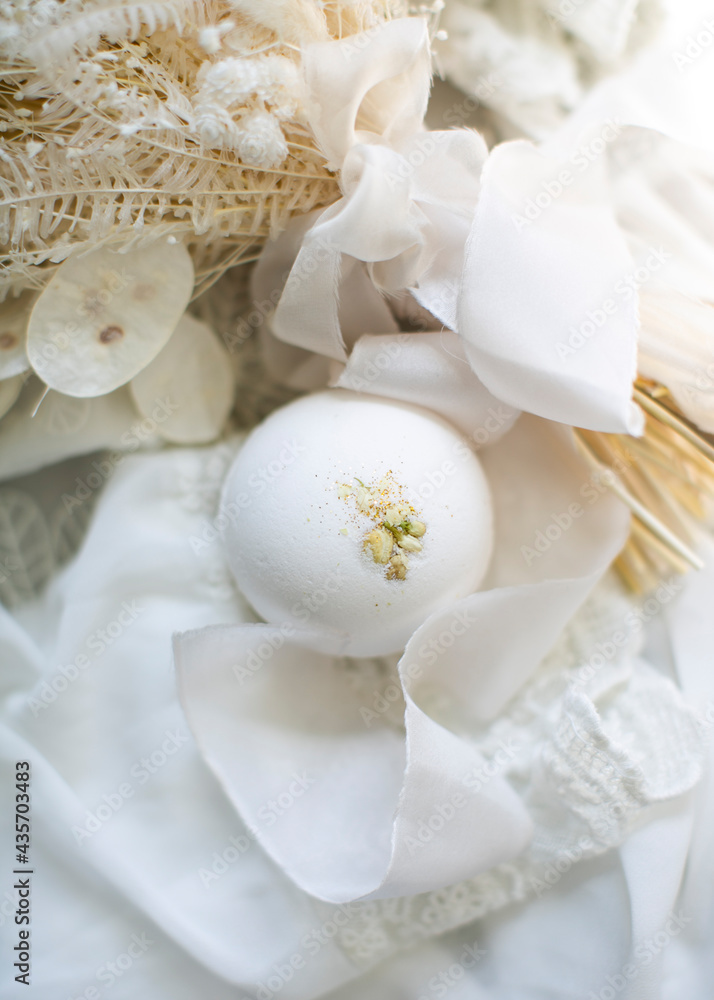 White jasmine bath bomb. Minimalistic spa concept White jasmine bath bomb. Minimalistic spa concept