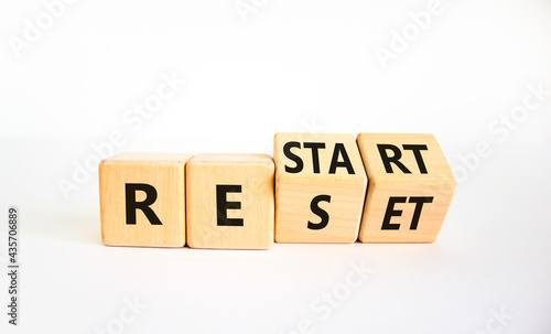 Reset and restart symbol. Turned cubes and changed the word 'reset' to 'restart'. Beautiful white background. Business and reset - restart concept. Copy space.