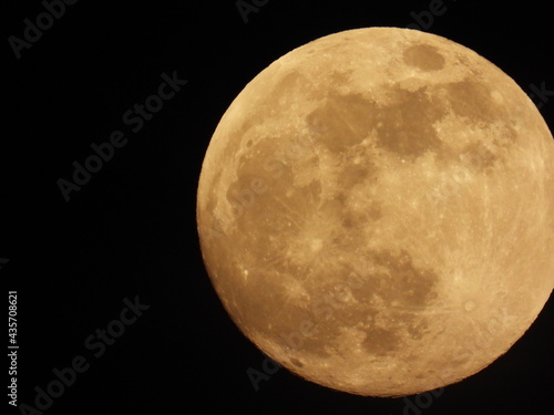 Full moon against the black sky