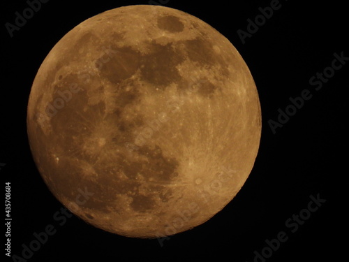 Full moon against the black sky