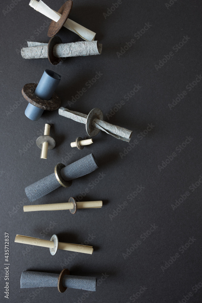 rusty metallic washers (stuffed with papers tubes) - photographed from above in a flat lay style rusty metallic washers (stuffed with papers tubes) - photographed from above in a flat lay style