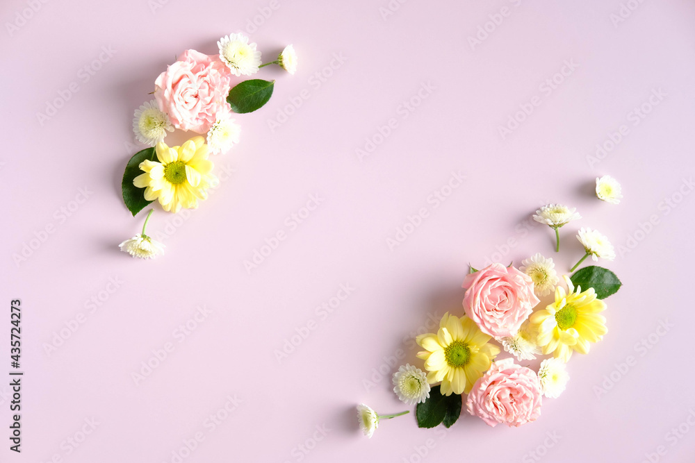 Flowers arrangement on pink background. Flat lay, top view. Floral frame, greeting card mockup.