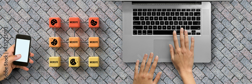 Dice with Cookie icons and the word WEBSITE and a laptop conceptual of the GDPR regulations introduced by the EU governing data collection and privacy of information for individuals online.