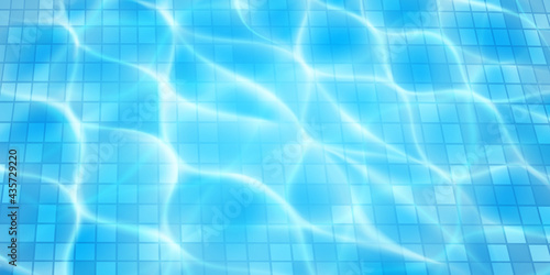 Swimming pool background with mosaic tiles, sunlight glares and caustic ripples. Top view of the water surface. In light blue colors