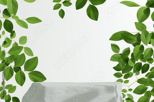 White stone product display podium with nature leaves background. 3D rendering	
