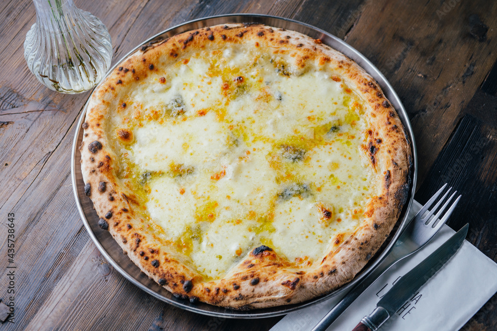 4 cheese pizza on a plate 4 cheese pizza on a plate