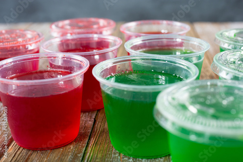 Fotografie A closeup view of several plastic cups filled with gelatin.