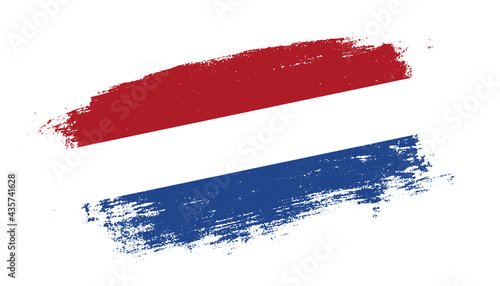 Flag of Netherlands country on brush paint stroke trail view. Elegant texture of national country flag
