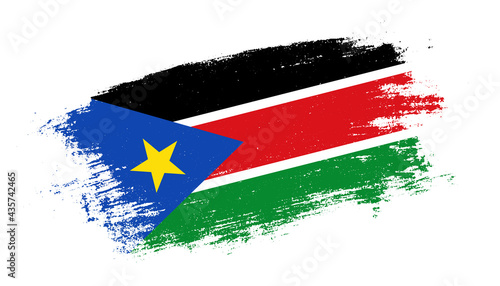 Flag of South Sudan country on brush paint stroke trail view. Elegant texture of national country flag