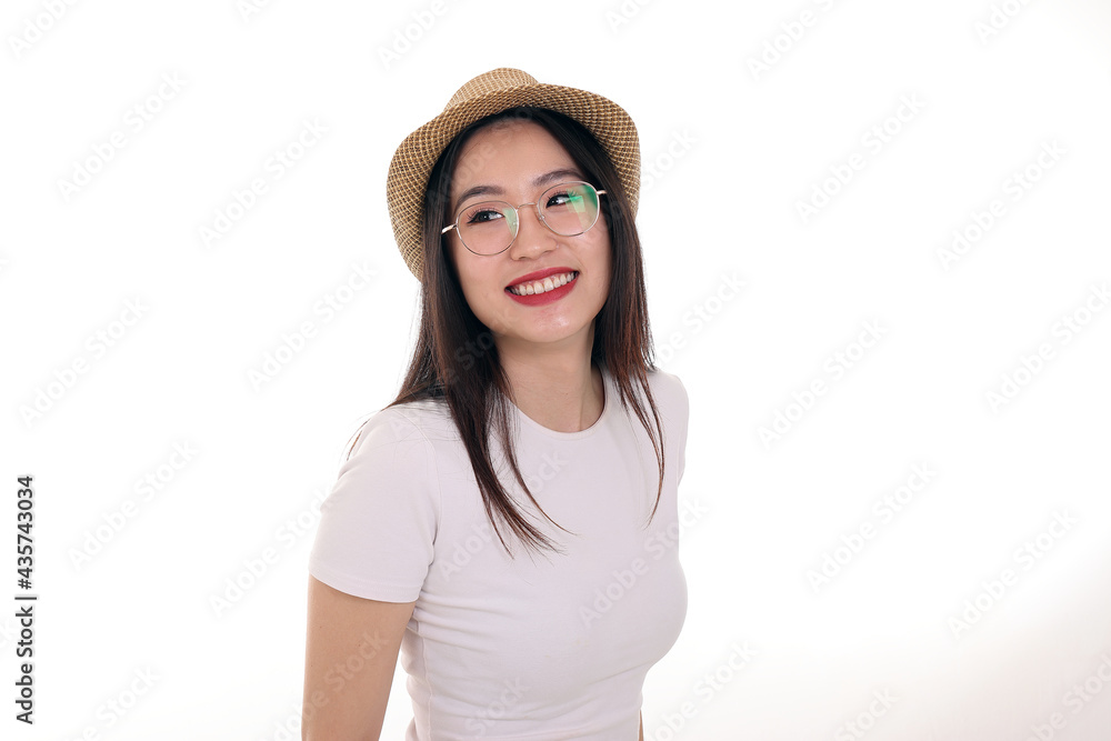 Beautiful young south east Asian woman wearing eyewear golden frame glasses hat pose fashion style white background look around copy text space Beautiful young south east Asian woman wearing eyewear golden frame glasses hat pose fashion style white background look around copy text space