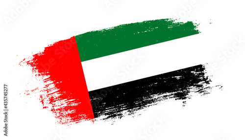 Flag of United Arab Emirates country on brush paint stroke trail view. Elegant texture of national country flag