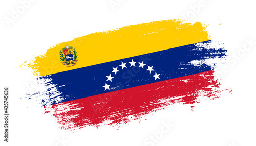 Flag of Venezuela country on brush paint stroke trail view. Elegant texture of national country flag