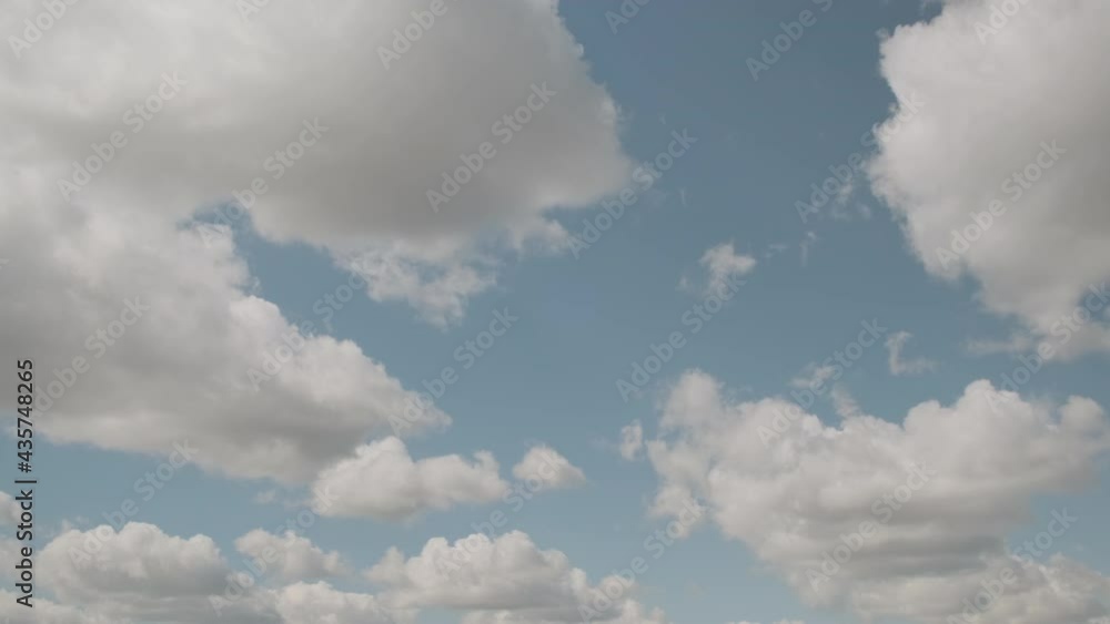 Timelapse of blue sky with moving fluffy clouds in clear weather. Timelapse of blue sky with moving fluffy clouds in clear weather.