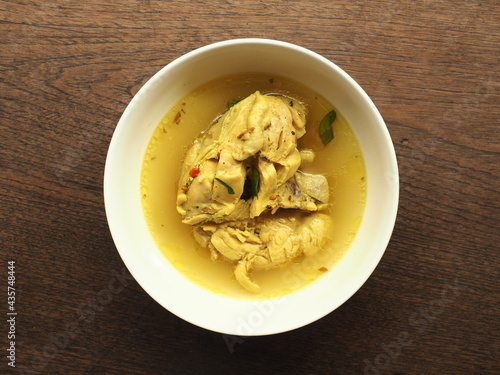 Top view bowl of chicken turmeric broth
