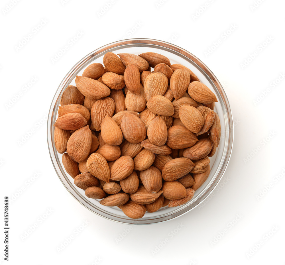 Top view of peeled apricot kernels in glass bowl Top view of peeled apricot kernels in glass bowl