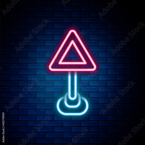 Glowing neon line Triangle warning blank icon isolated on brick wall background. Traffic rules and safe driving. Colorful outline concept. Vector