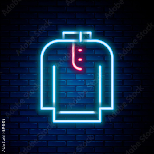 Glowing neon line Shirt kurta icon isolated on brick wall background. Colorful outline concept. Vector