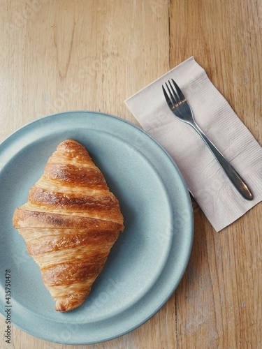 A dish of cooked plain croissants ready to eat