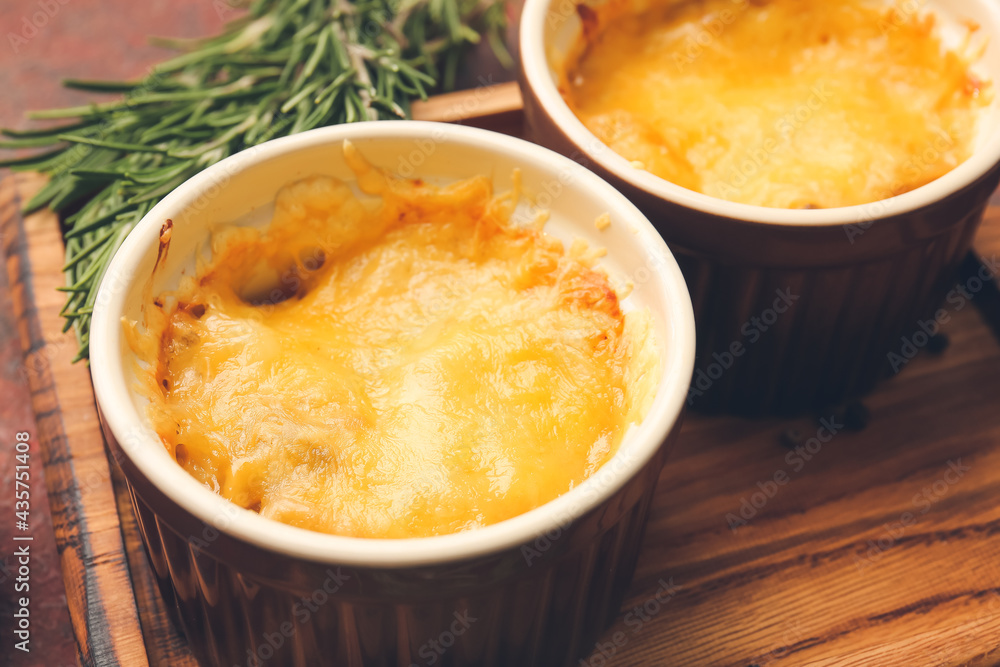 Ramekins with tasty julienne on table, closeup Ramekins with tasty julienne on table, closeup